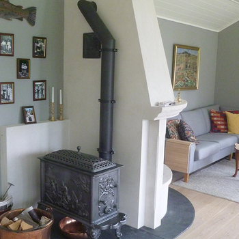 7 - Buet skråstilt hjørnepeis på rettvegg